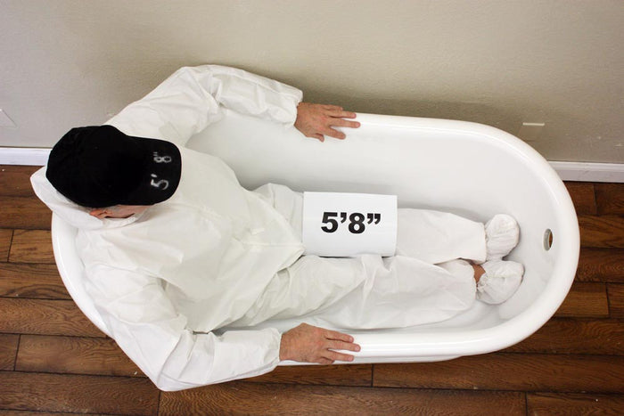 Body height comparison showing a person in 54" x 28" Clawfoot Tub “SanSiro HL-Danube CLWH54” CoreAcryl Acrylic